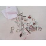 Large quantity of silver stone set rings, pendants and other jewellery in white pouches