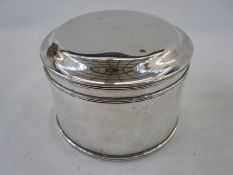A 1920s silver lidded circular box, plain form with reeded decoration to rims, Chester 1923, maker