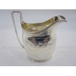 George III silver cream jug, probably by Christian Fuller, London 1799, of oval form with reeded