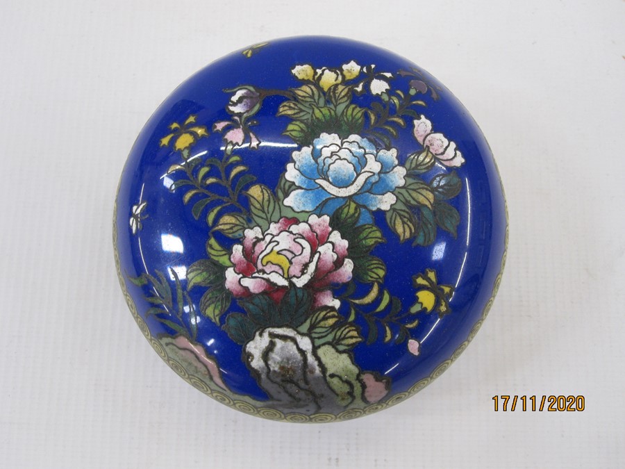 Cloisonne enamel circular bowl and cover, blue ground and decorated with flowers and butterflies,