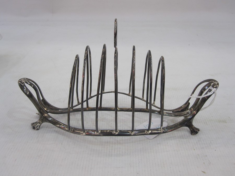 George III silver toastrack, six-division on an openwork boat-shaped frame, with four pad feet,