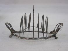 George III silver toastrack, six-division on an openwork boat-shaped frame, with four pad feet,