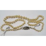 Cultured pearl necklace, string-strand, graduated with silver clasp, 44cm long  Condition
