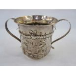 LOT WITHDRAWN ****************  A George III silver two-handled christening mug, repousse and