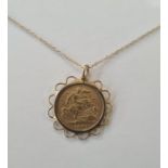 Victorian 1901 half sovereign in pendant mount with pierced scallop border on fine 9ct gold chain