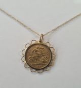 Victorian 1901 half sovereign in pendant mount with pierced scallop border on fine 9ct gold chain