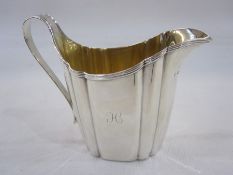 George III silver cream jug, London 1797, maker's mark rubbed, of shaped oval form with reeded