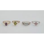 9ct gold and peridot ring, a 9ct gold set oval amethyst-coloured stone ring, a white gold, pink