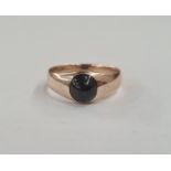 Gold-coloured metal and sapphire ring set oval cabochon stone