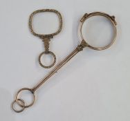 Pair gold-plated folding lorgnettes and another single gilt metal/pinchbeck eye glass