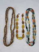 Agate and green stone necklace, amber-type necklace and another (3)