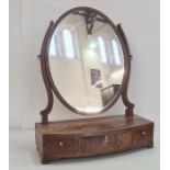 19th century mahogany oval swing toilet mirror, the bowfront base with three drawers, to ogee