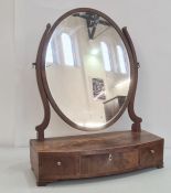19th century mahogany oval swing toilet mirror, the bowfront base with three drawers, to ogee