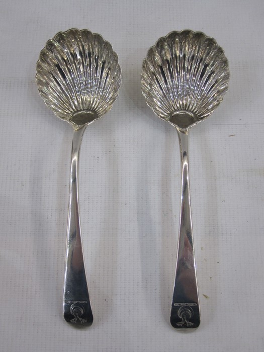 Pair of 18th century silver spoons, scallop-shaped bowl, both monogrammed and crested, London, maker