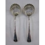 Pair of 18th century silver spoons, scallop-shaped bowl, both monogrammed and crested, London, maker