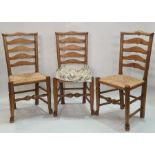 Set of four ash and elm ladderback dining chairs with rush seats