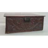 17th century oak bible box, the plain rectangular top, the carved front with tulips and other