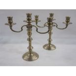 Pair of late 20th century silver-mounted three-branch candelabra on circular turned bases, London