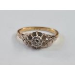 18ct gold and solitaire diamond ring, illusion set and raised with foliate shoulders