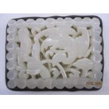 Chinese pale celadon carved jade openwork plaque, Ming dynasty, rectangular and carved with a wild