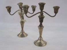 Pair of American sterling silver candelabra by Reed & Barton, each with two scrolling branches on