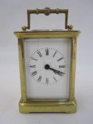A French carriage clock, Roman numeral enamel dial, 10.5cm high not including handle