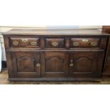 Antique oak sideboard having quadrant mould edge, three frieze drawers each with chamfered edge,