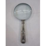 A 1920s silver handled magnifying glass, repoussé decoration to handle, Sheffield 1924, makers