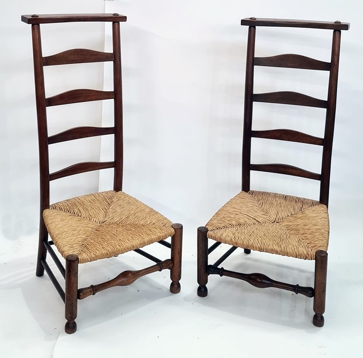 Pair of 20th century rush seated ladderback country prie-dieu chairs with low seats, on turned