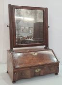 19th century walnut swing toilet mirror, the rectangular plate on fluted supports, the base with