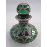 Silver-coloured metal mounted green glass miniature scent bottle having spherical stopper, the squat