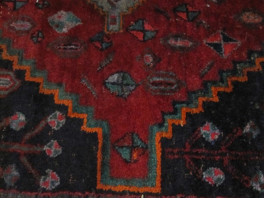 Persian Hamadan village rug, the blue ground with three red ground medallions, the field with - Image 3 of 4