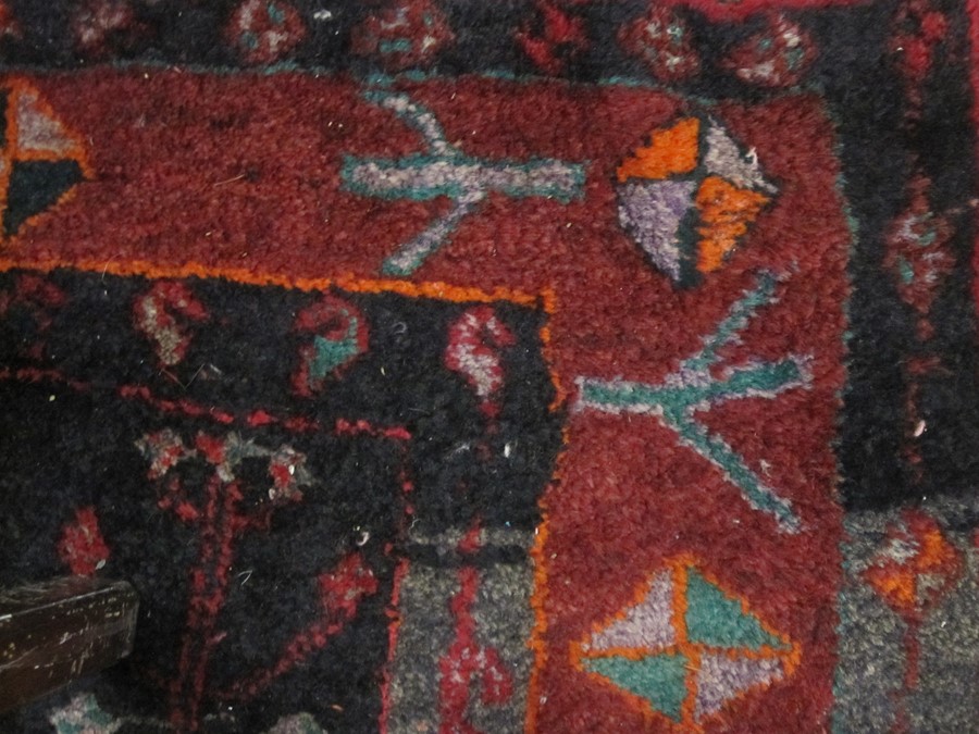 Persian Hamadan village rug, the blue ground with three red ground medallions, the field with - Image 2 of 4