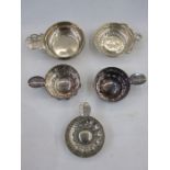 Silver wine taster by Theodore Rossi, London 1929, of plain circular form with pierced handle, 3.