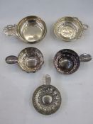 Silver wine taster by Theodore Rossi, London 1929, of plain circular form with pierced handle, 3.