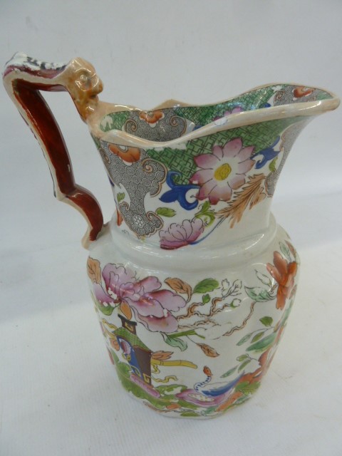 19th century Masons ironstone jug, the handle with mask decoration, the body foliate decorated in