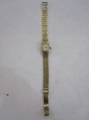 Lady's 9ct gold Accurist bracelet watch, the circular dial with baton markers and integral 9ct