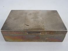 A 1950s silver mounted rectangular box, lined decoration to lid, London 1956, makers Garrard & Co