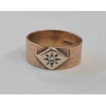 9ct gold and diamond ring, the bark finish band set with single diamond in lozenge surround, 9g