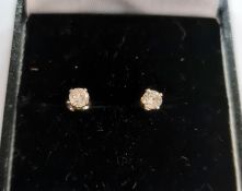 Pair of diamond and silver stud earrings, each stone approximately 0.10ct, claw set