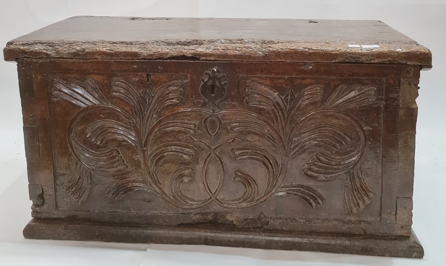 Antique carved oak coffer, the front panel with foliate scroll and all on plinth base, 91cm wide (