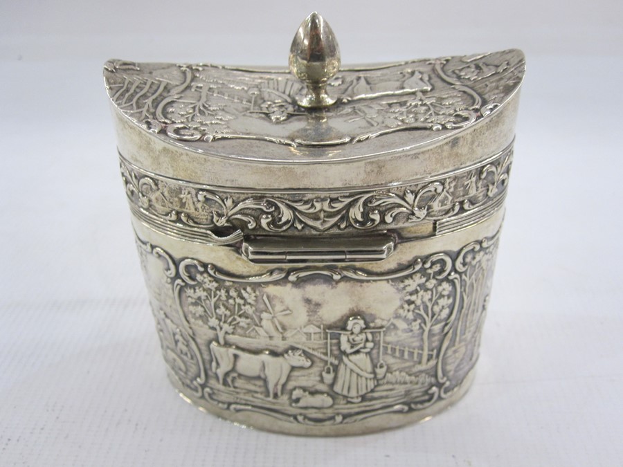 Dutch silver tea caddy with date letter for 1927 of oval form decorated with panels of rural life - Image 2 of 2