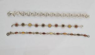 Silver bracelet set various amber stones in flowerhead setting, another silver and amber bracelet
