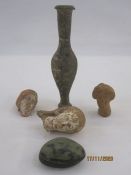 Three roman terracotta female heads, two with remnants of paint, a pottery unguent bottle, 14.5cm