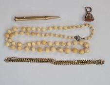 19th century gold coloured seal fob set with blank cornelian tablet, a Sheaffer's rolled gold