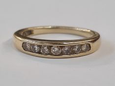 Gold and diamond half eternity ring, the seven diamonds channel set