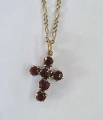 9ct gold and garnet cross pendant on 9ct gold Figaro 24" chain