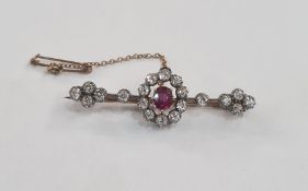 Antique ruby and diamond bar brooch set oval ruby surrounded by circlet of diamonds and further
