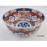 Japanese Imari porcelain bowl with decoration in typical colours of fans in shaped panels amid