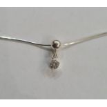 Solitaire diamond drop pendant, claw set, in silver mount, on fine silver chain, the stone